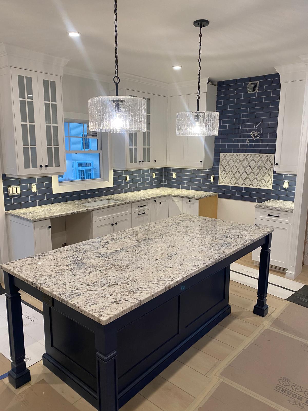 Custom kitchen with blue subway tile backsplash